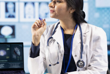 Physician meeting with a patient to discuss medical test results in a cabinet, using advanced diagnostic tools to interpret x ray scans, demonstrating a professional healthcare approach.